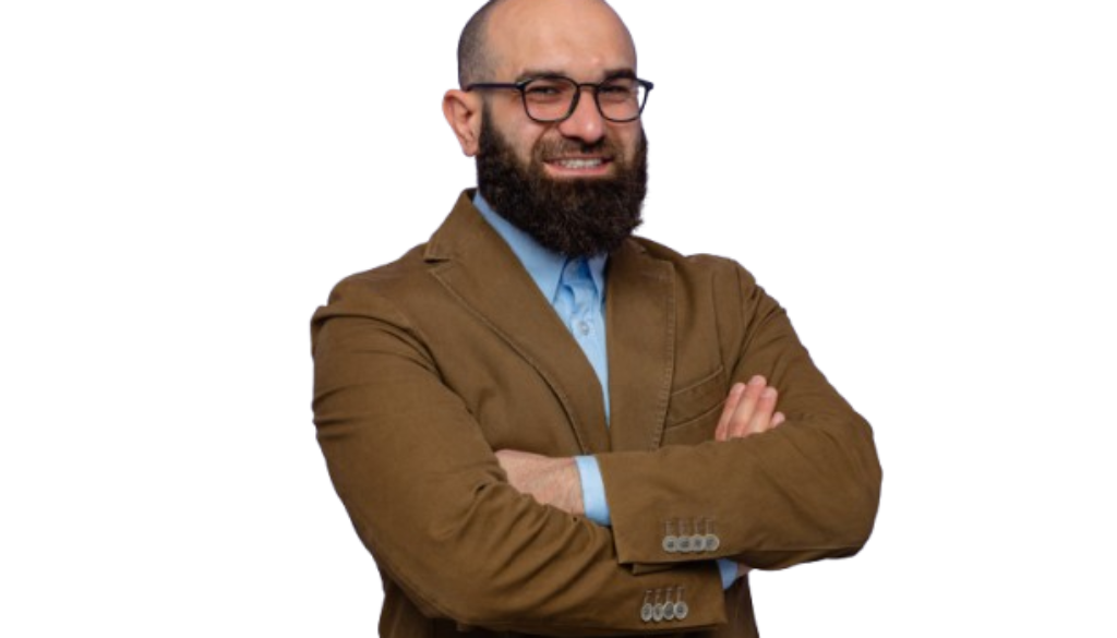 happy-confident-bearded-man-brown-suit-wearing-glasses-looking-camera-smiling-cheerfully-with-arms-crossed-standing-purple-background-removebg-preview